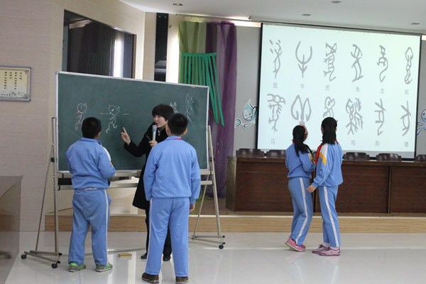 “碑林文化进校园”走进庆安小学(图1)